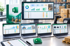 A Microsoft Excel warehouse management dashboard shown across multiple devices, including a desktop monitor, four laptops, a tablet, and a smartphone, alongside the green and white Excel software box and a green Excel app icon on a desk. The scene is set in a modern office environment with cardboard boxes and a barcode scanner in the background.